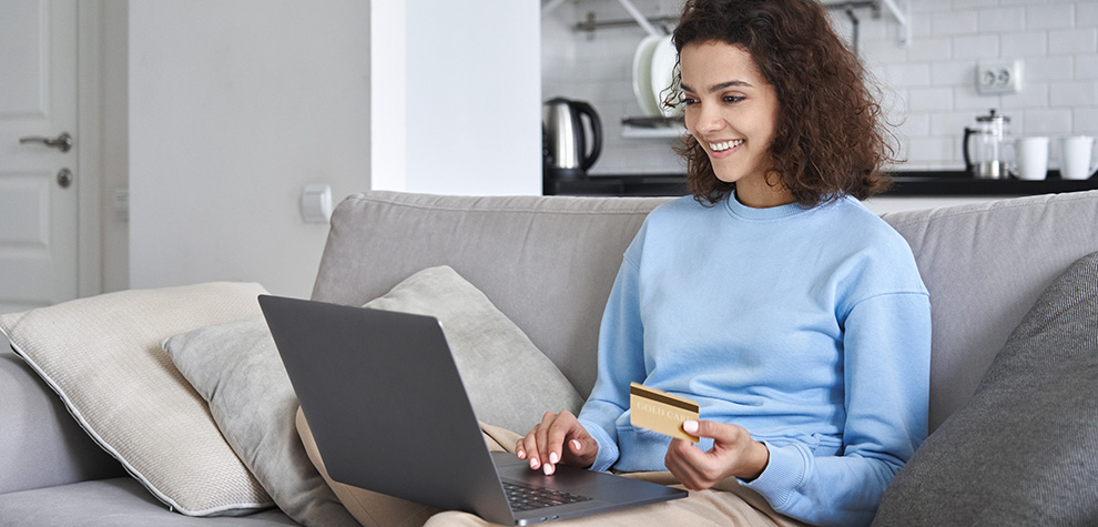 Woman on laptop buying edibles online in Canada. weed dispensary. cheapweed. edibles canada. 