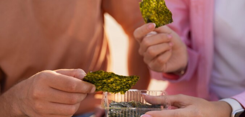 Two people sharing cannabis edibles, symbolizing quality products and service from a proper online pot delivery dispensary