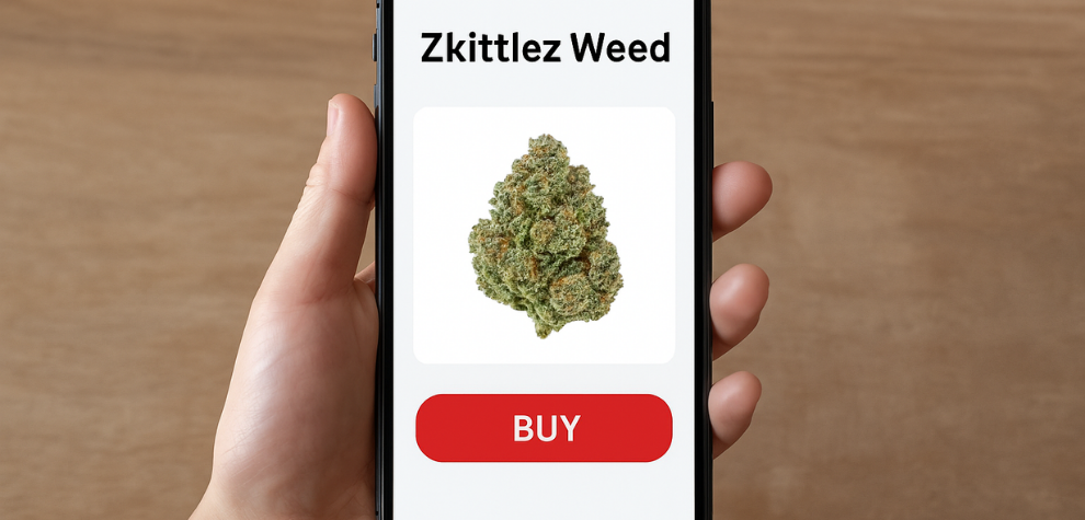 Hand holding a smartphone displaying a purchase screen for Zkittlez weed with a prominent buy button