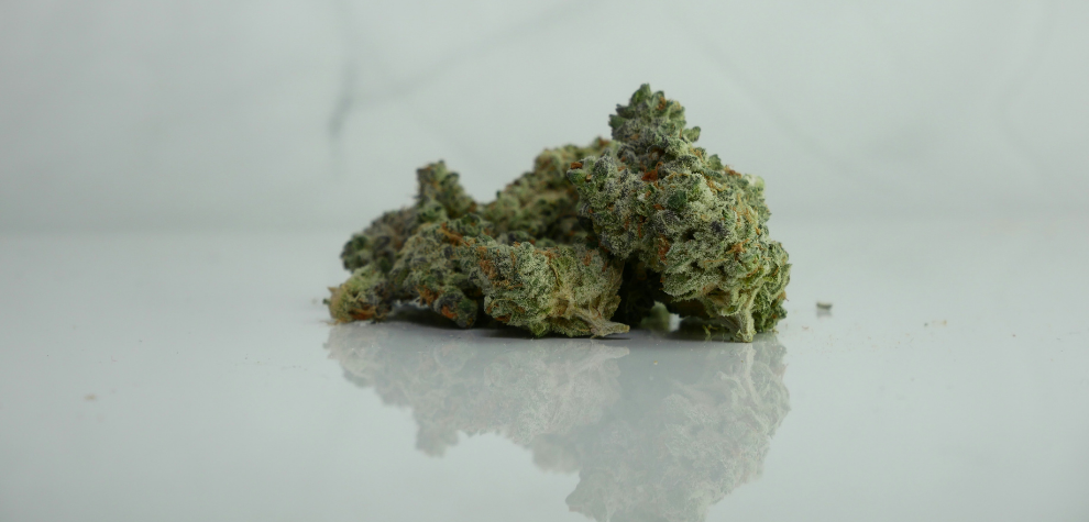 Top shelf cannabis buds displayed on a clean surface from an online cannabis store