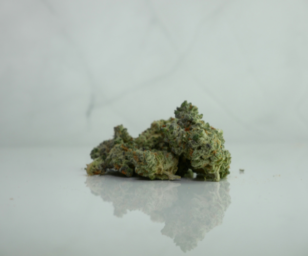 Top shelf cannabis buds displayed on a clean surface from an online cannabis store