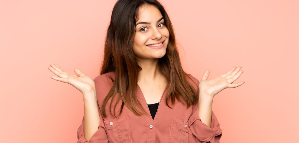 Smiling woman shrugging with confidence, reflecting why Canadians enjoy the effects and quality of Astro Pink weed